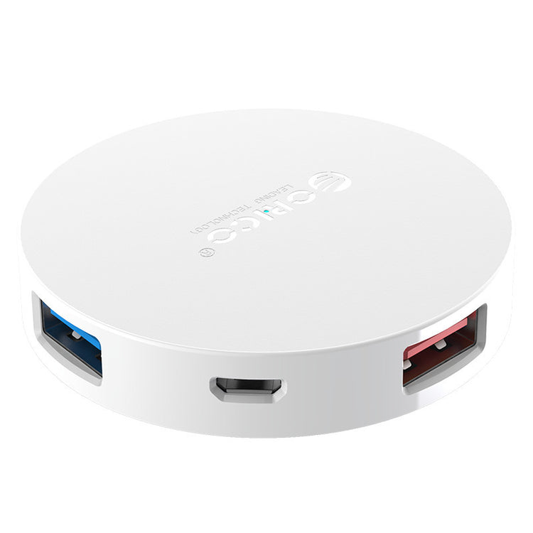 a white circular device with multiple ports