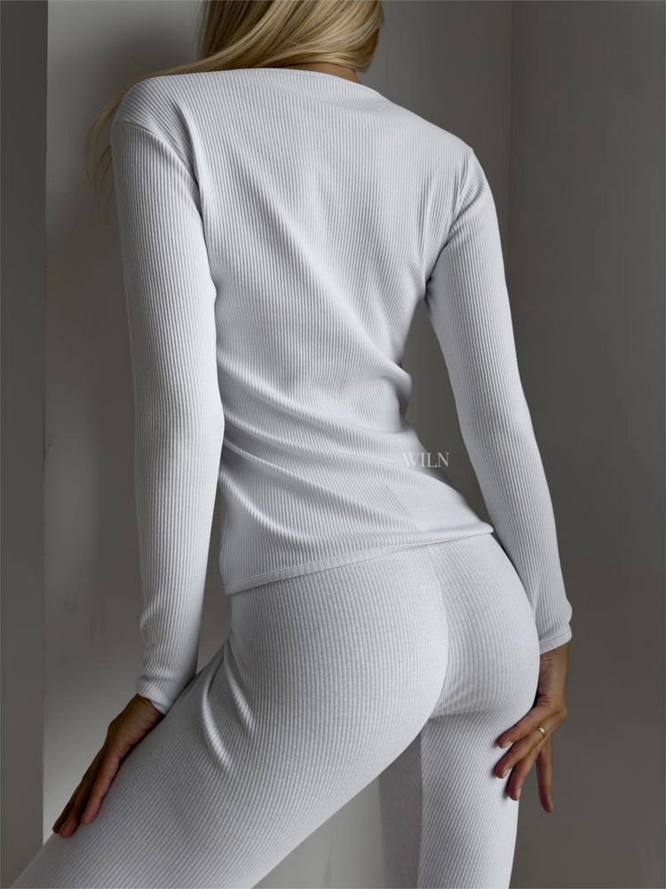 a woman in white outfit