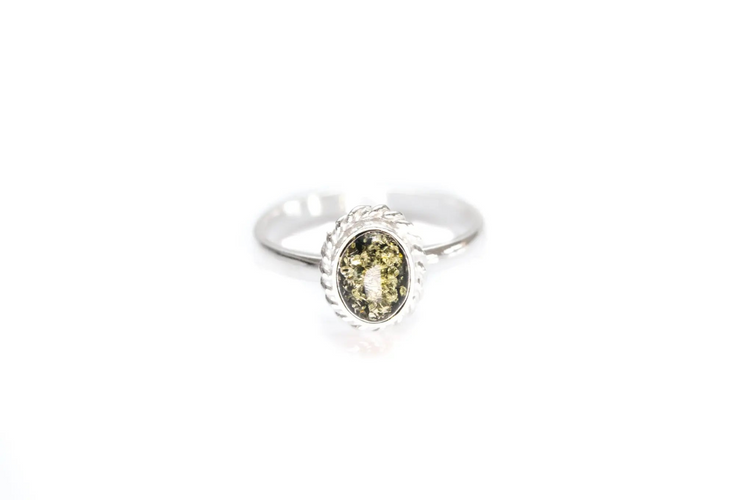 a ring with a green stone in the middle