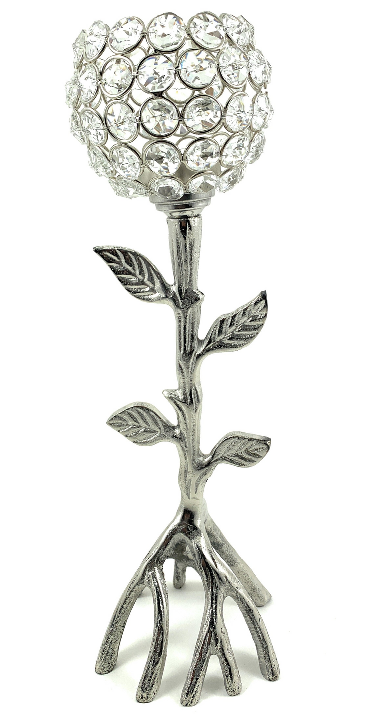 a silver candle holder with a crystal ball