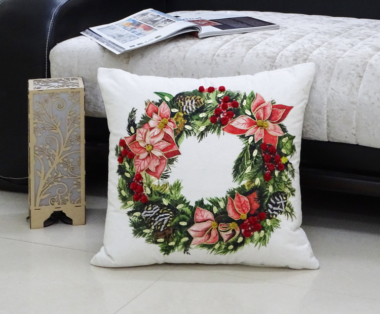 a pillow with a wreath on it