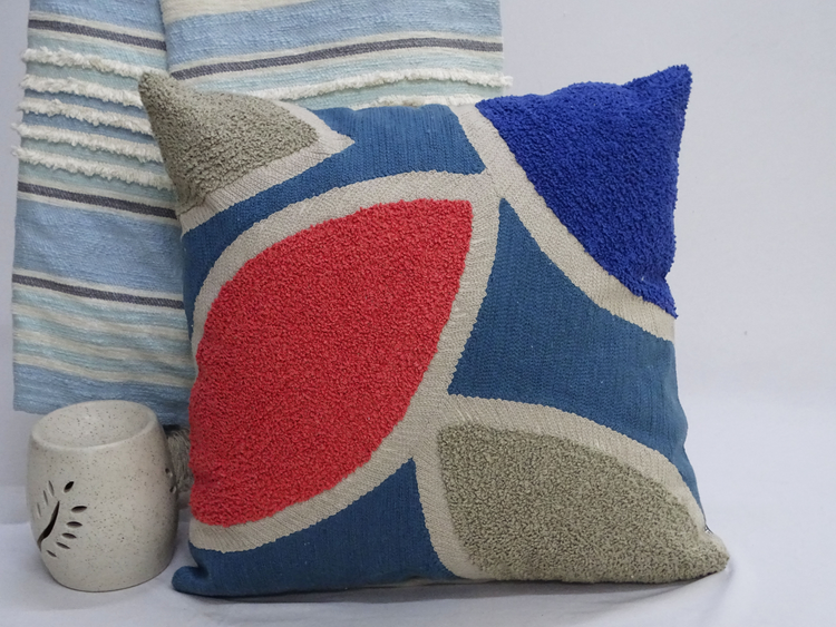 a pillow with a red and blue design