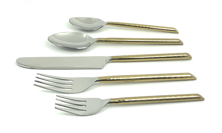 a group of silverware with gold handles