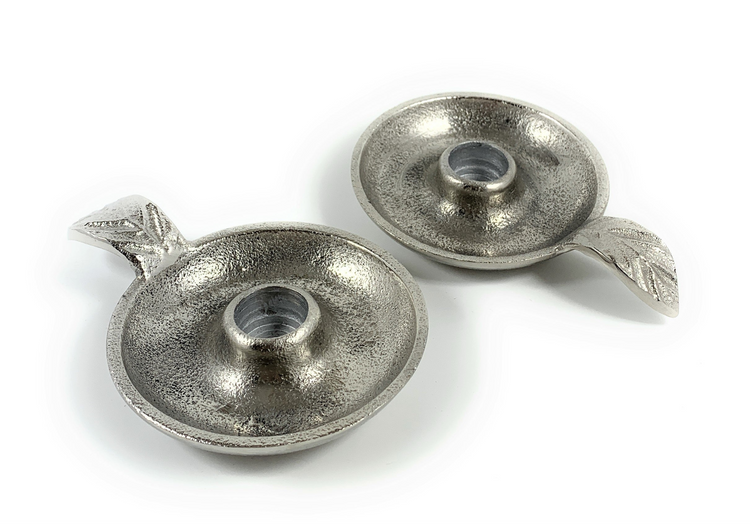 a pair of silver candlesticks