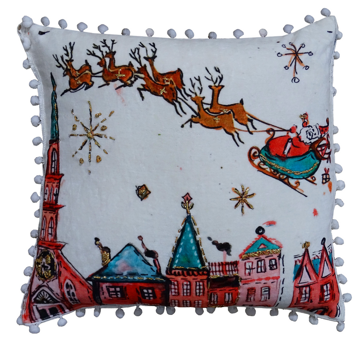 a pillow with a painting of santa claus flying on a sleigh