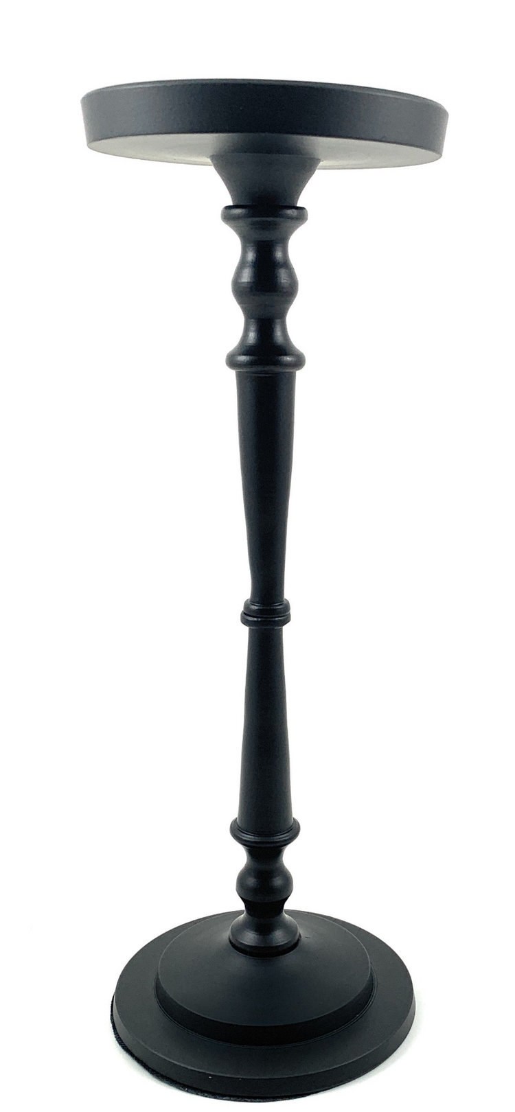 a black tall object with a white background