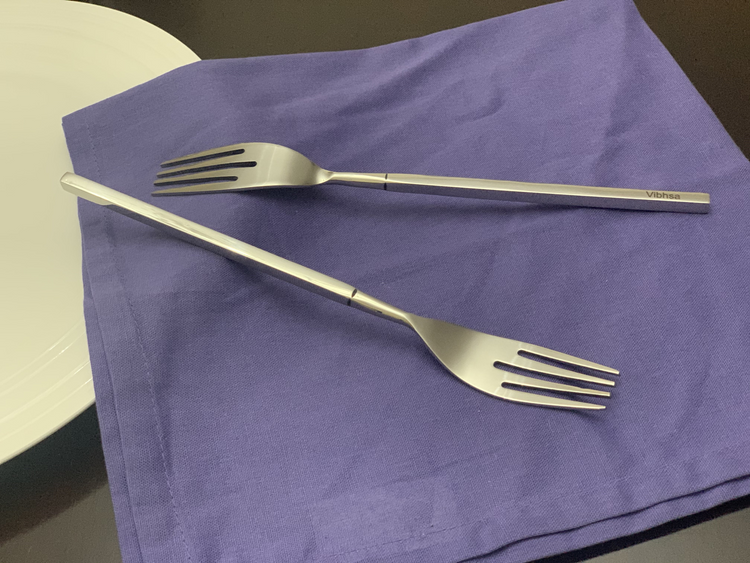 a fork and knife on a napkin