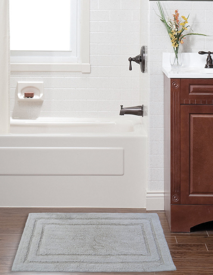 a bathroom with a white bathtub and sink