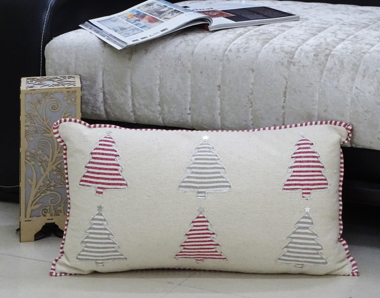 a pillow with trees on it