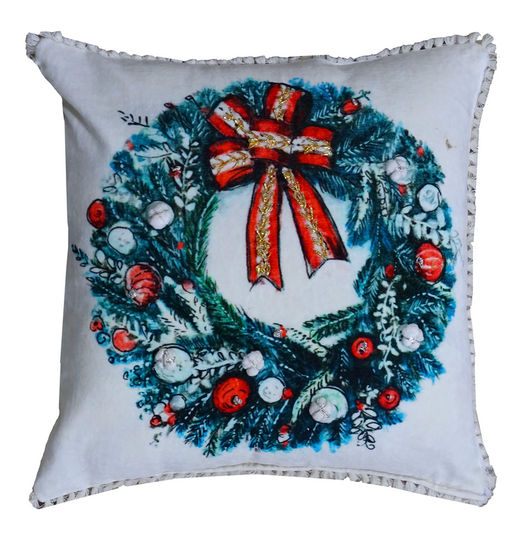 a pillow with a wreath on it