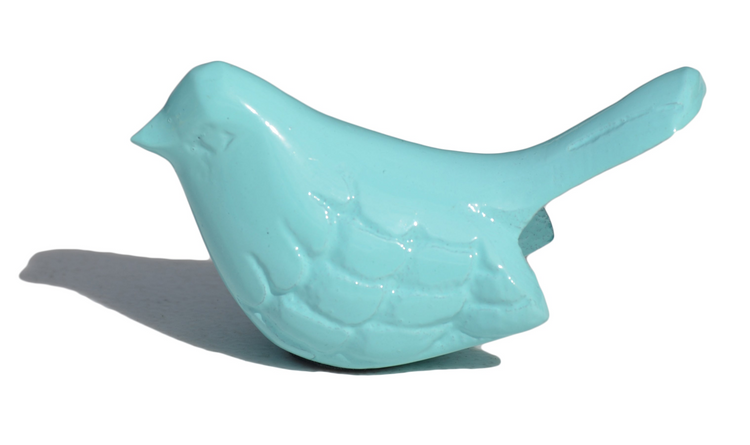 a blue bird statue on a white background