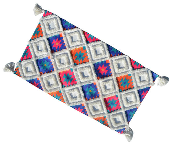 a colorful rug with white and blue squares