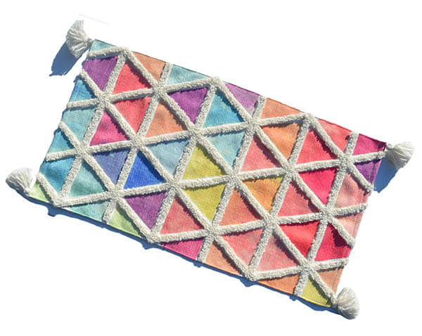 a colorful rug with white threads