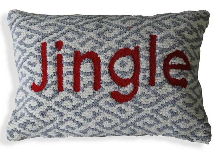 a pillow with red letters on it