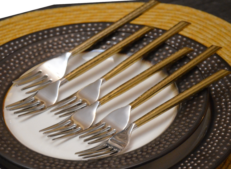 a group of forks on a plate