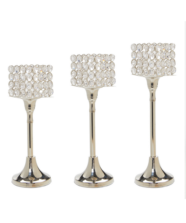 a group of candlesticks with crystals