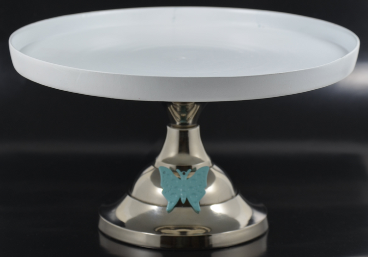 a white plate with a blue butterfly on it