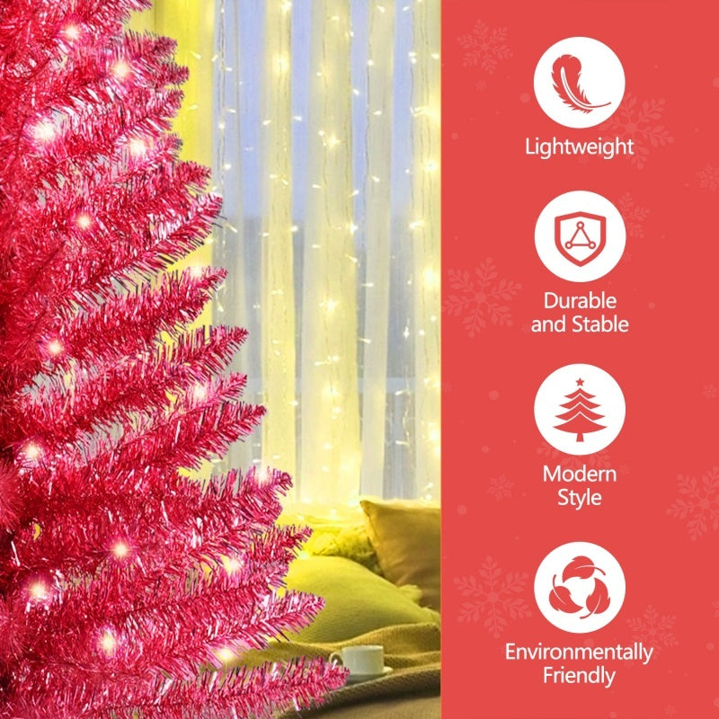 a pink christmas tree with lights