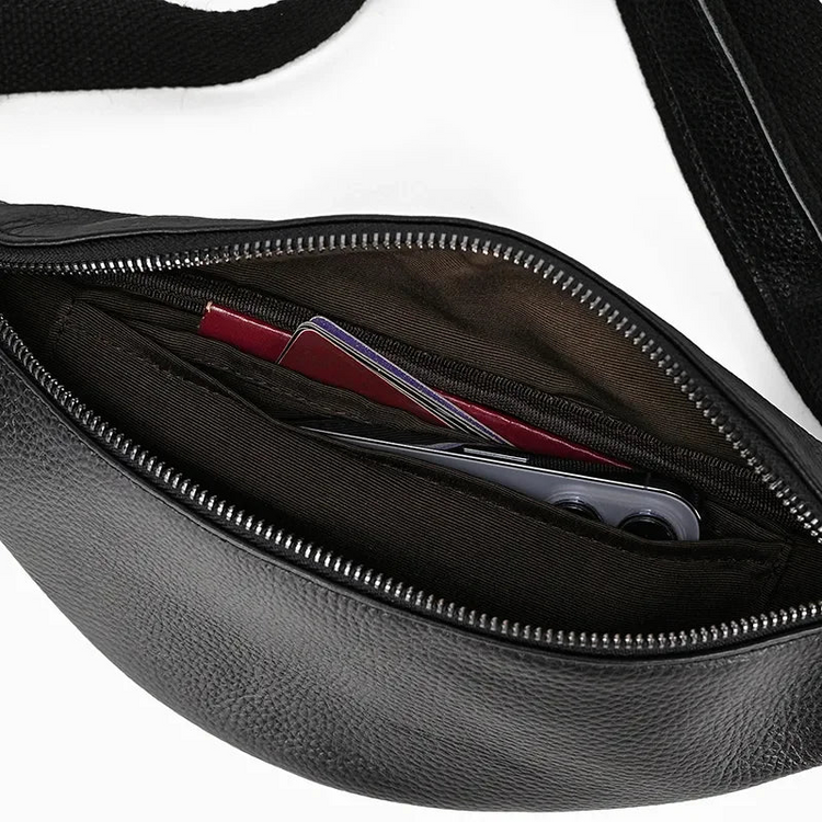 a black pack with a pocket knife and a card in it