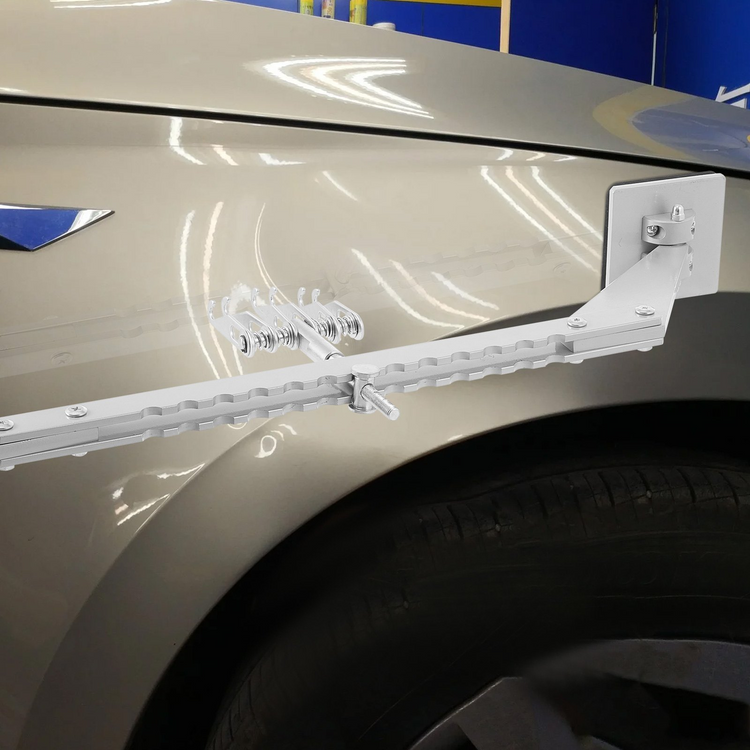 a white metal object on a car