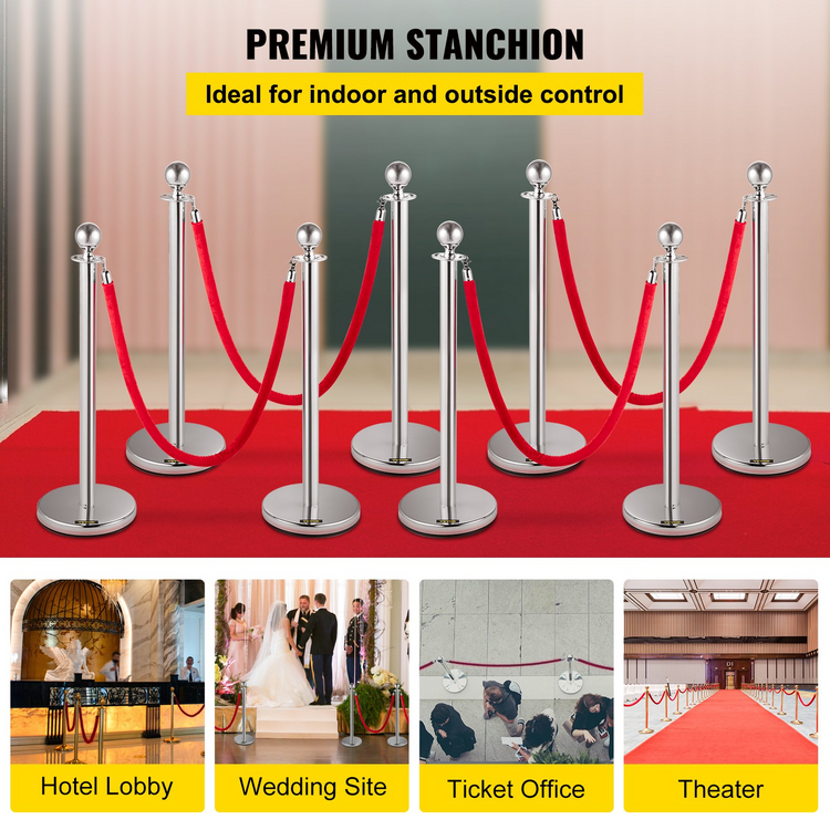 a red carpet with silver poles and rope