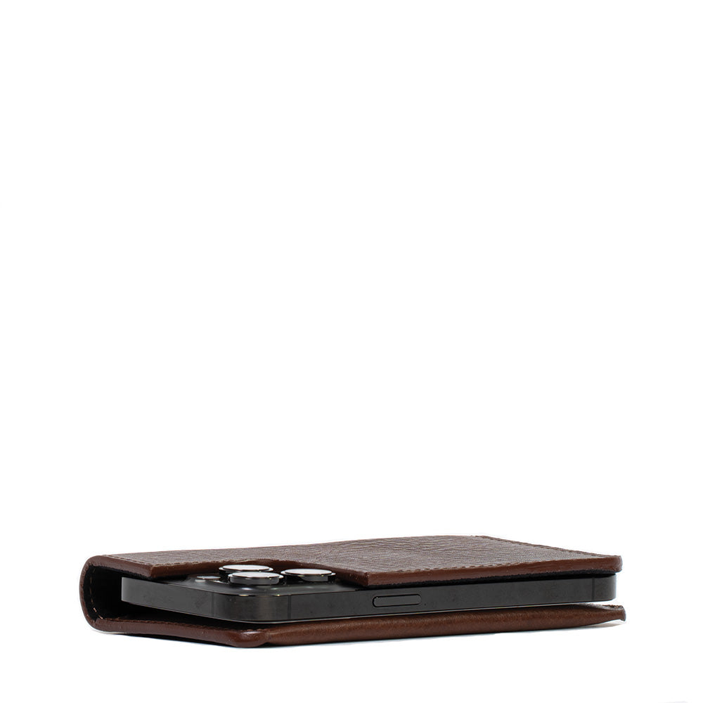 a cell phone in a leather case