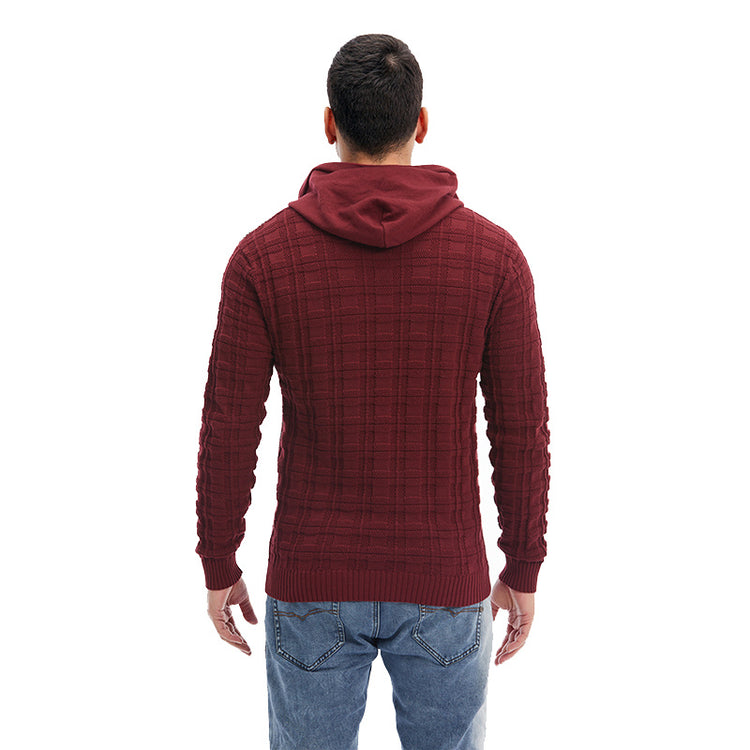 a man wearing a red sweater