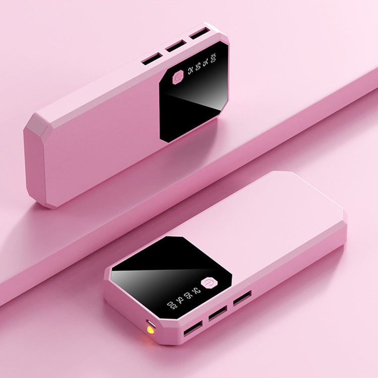 a pink rectangular device with a black square on top