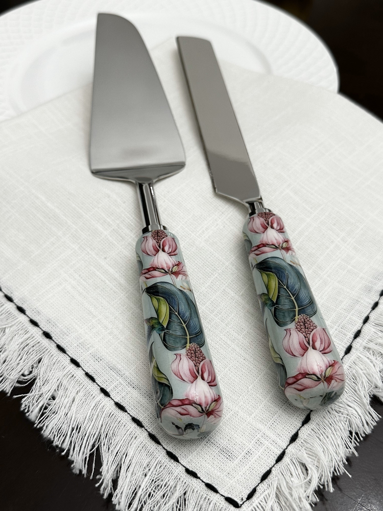 a cake server and spatula on a white napkin