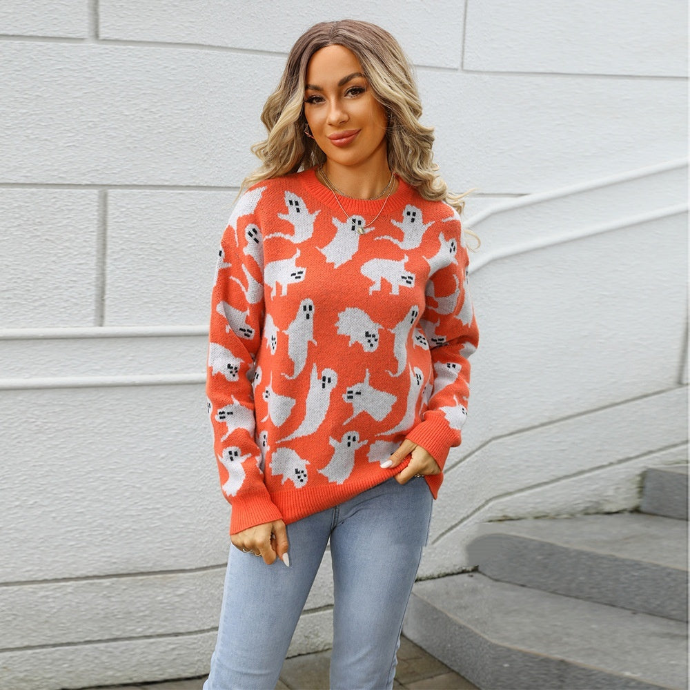 a woman in an orange sweater with white ghosts on it