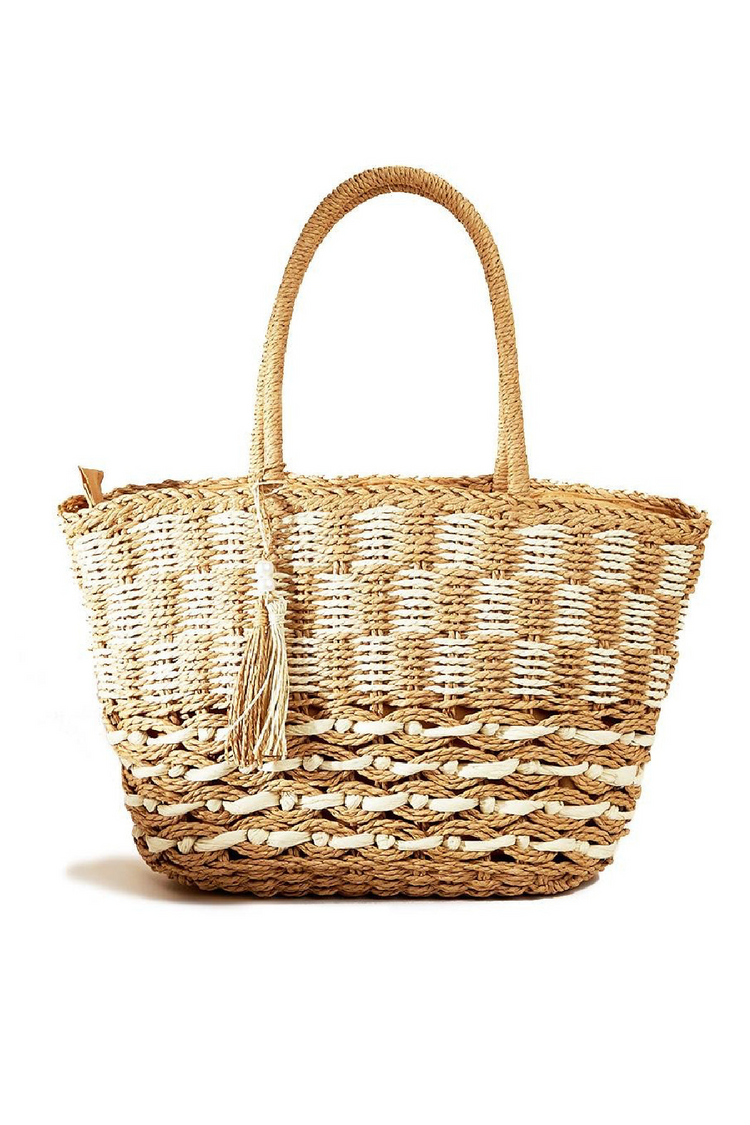 a woven bag with a tassel