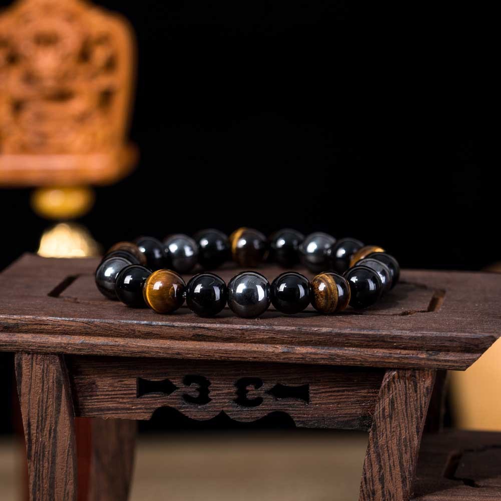 a bracelet on a small wooden stand