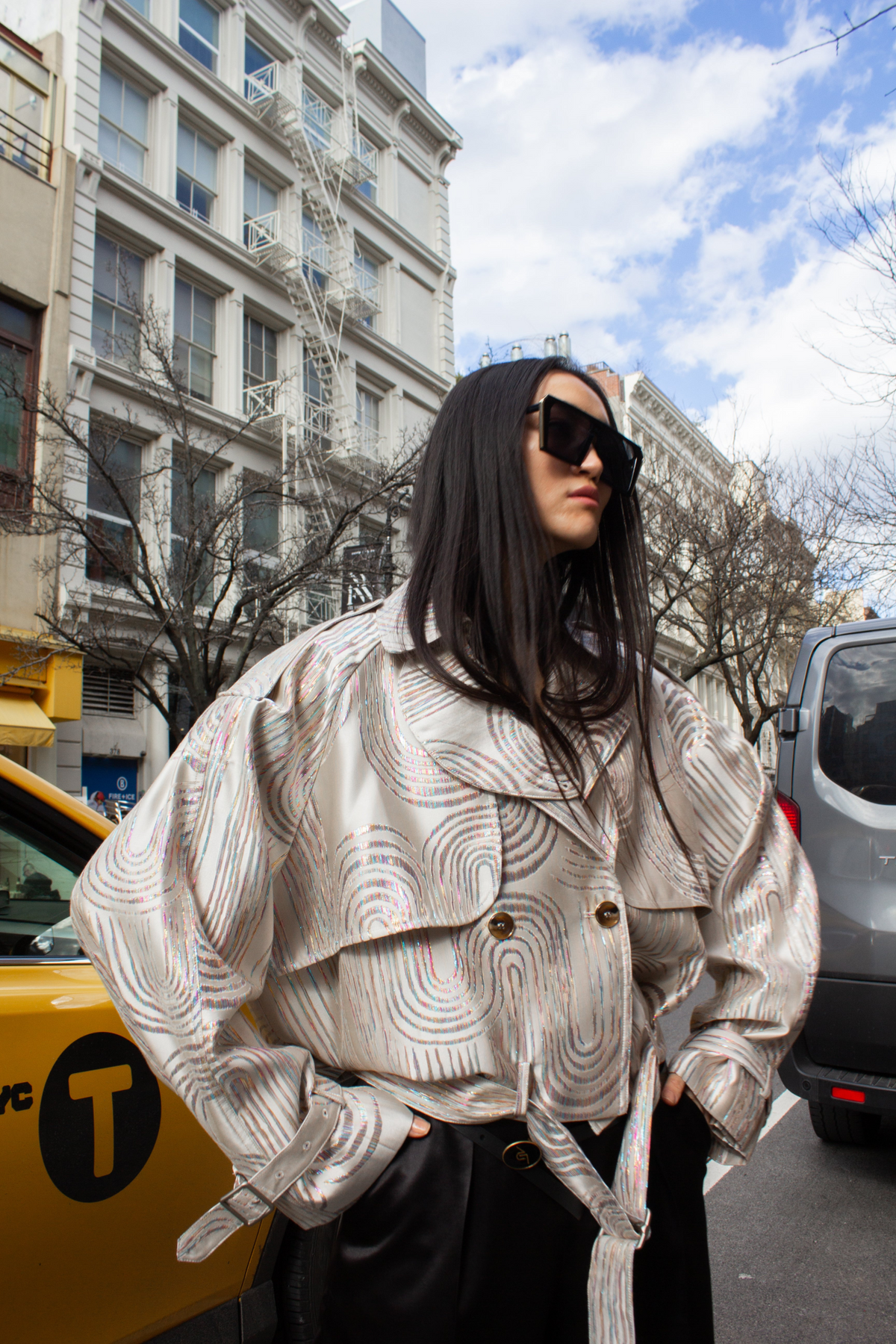 a woman in sunglasses and a jacket