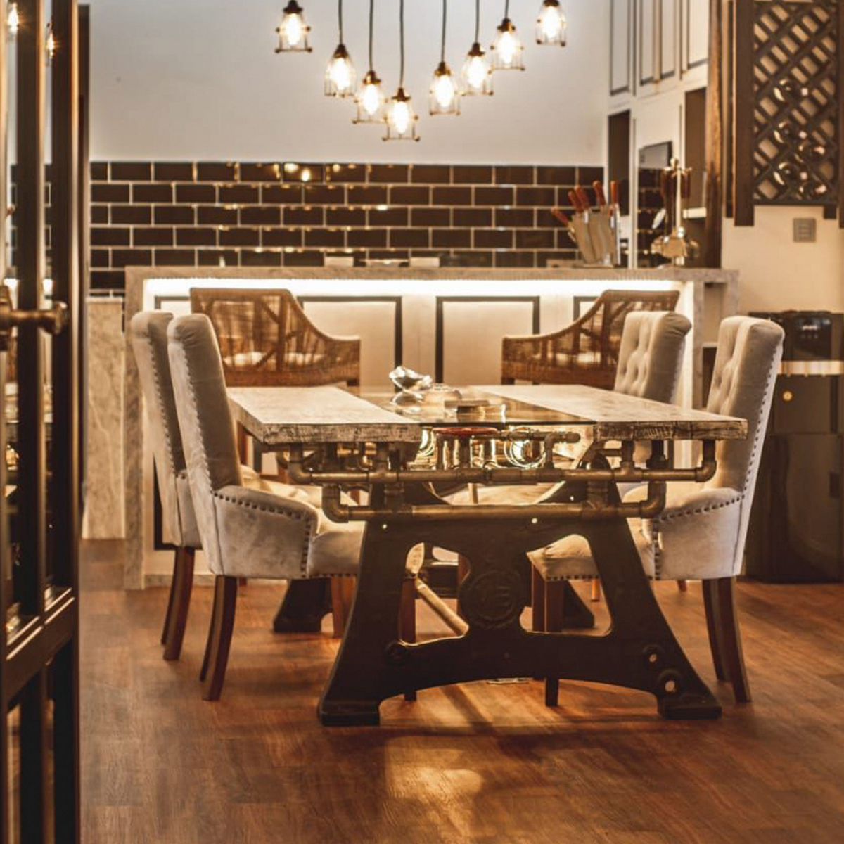 a dining table with chairs and a chandelier