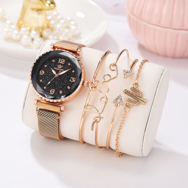 a watch and bracelets on a white case