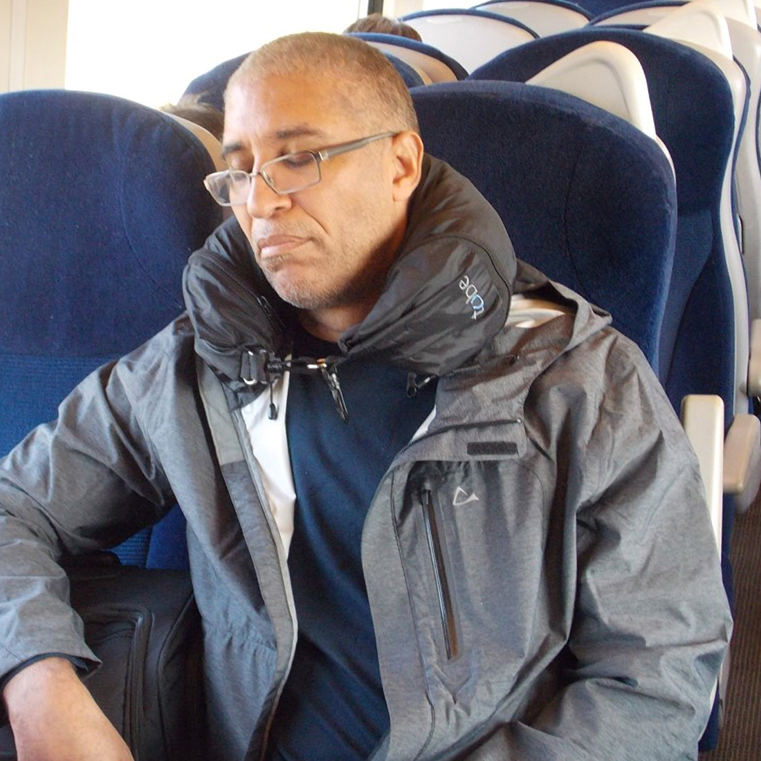a man sleeping on a plane