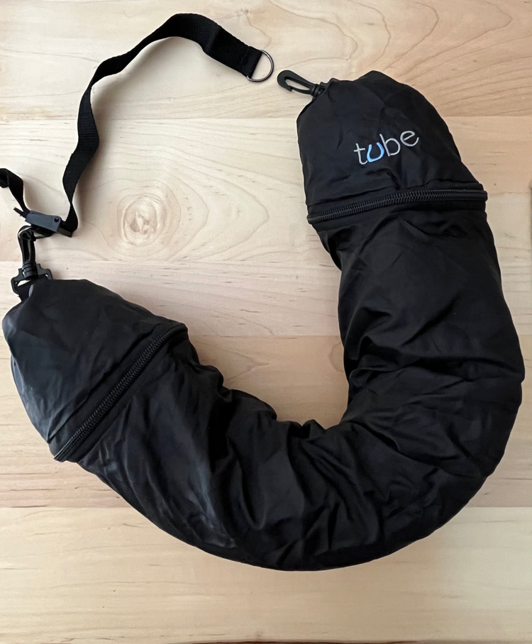 a black bag on a wood surface