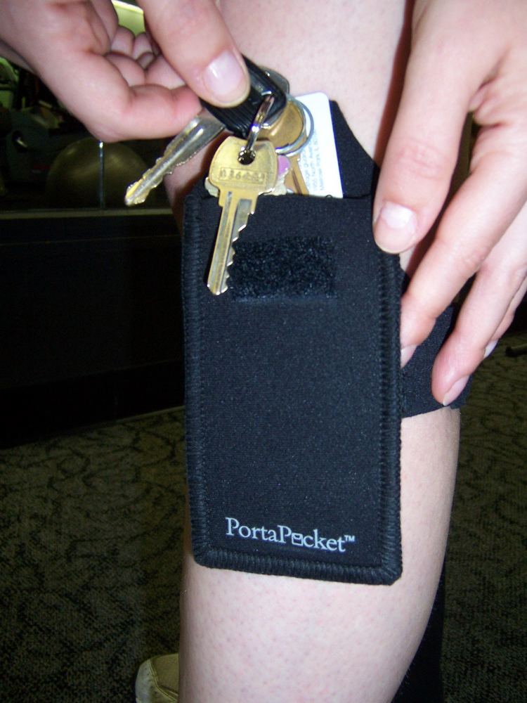 a person holding keys in their pocket