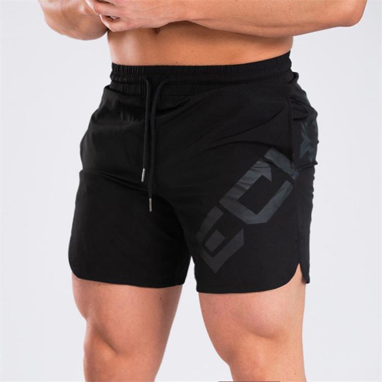 a man wearing black shorts