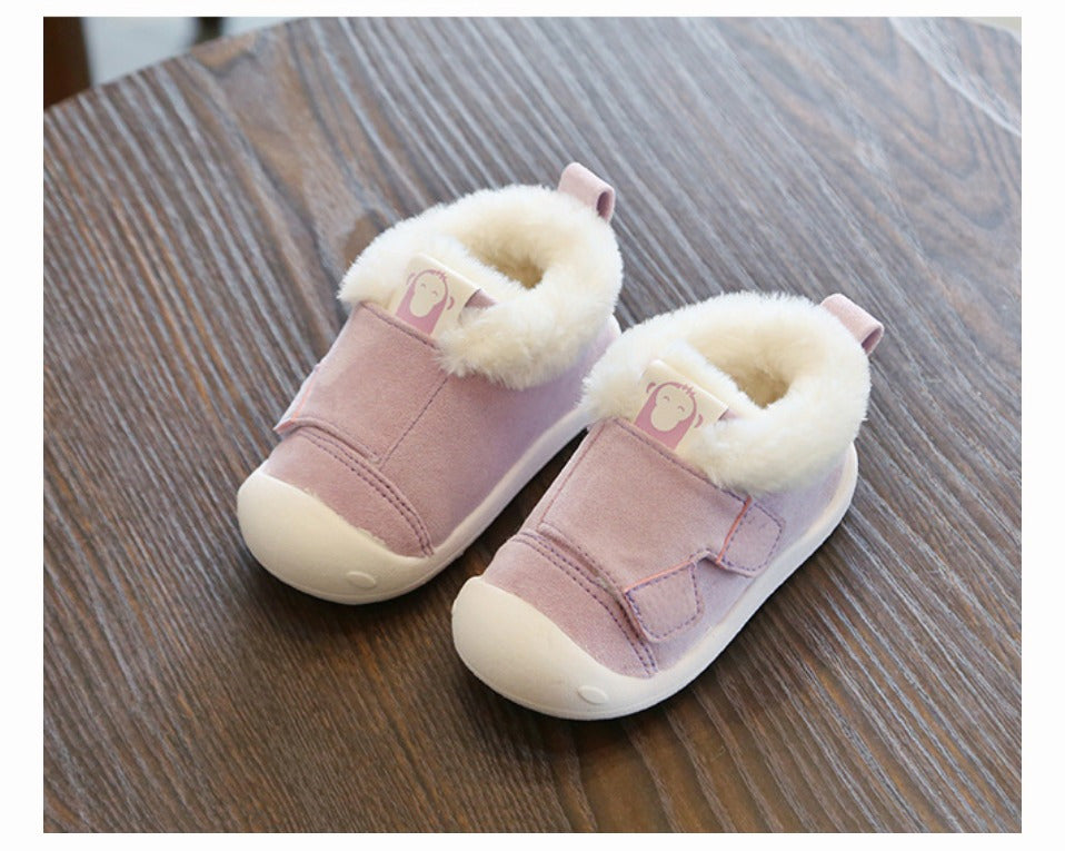 a pair of pink baby shoes