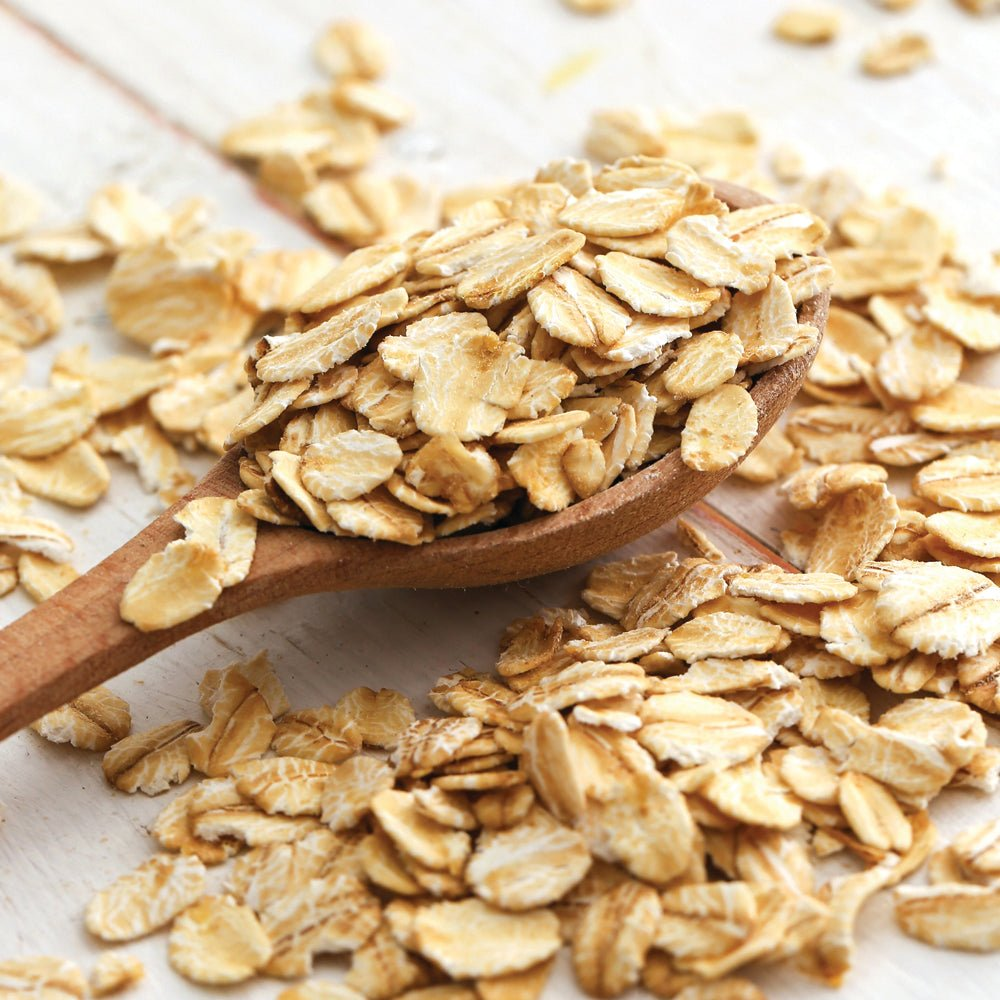 a spoonful of oats on a table