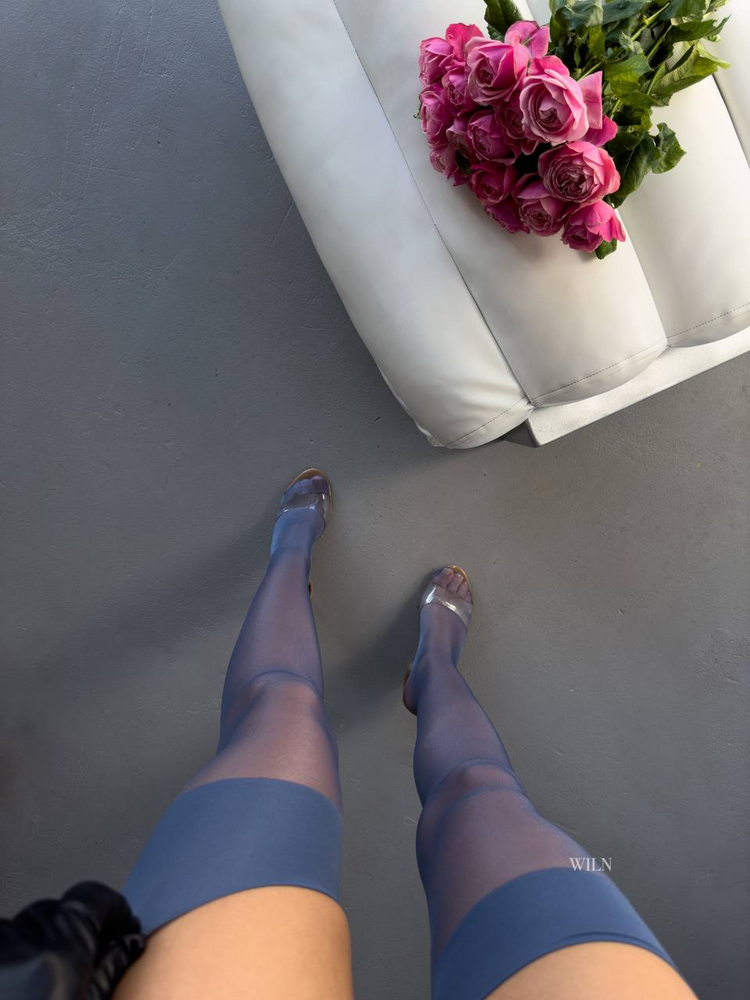 a person's legs and a bouquet of flowers