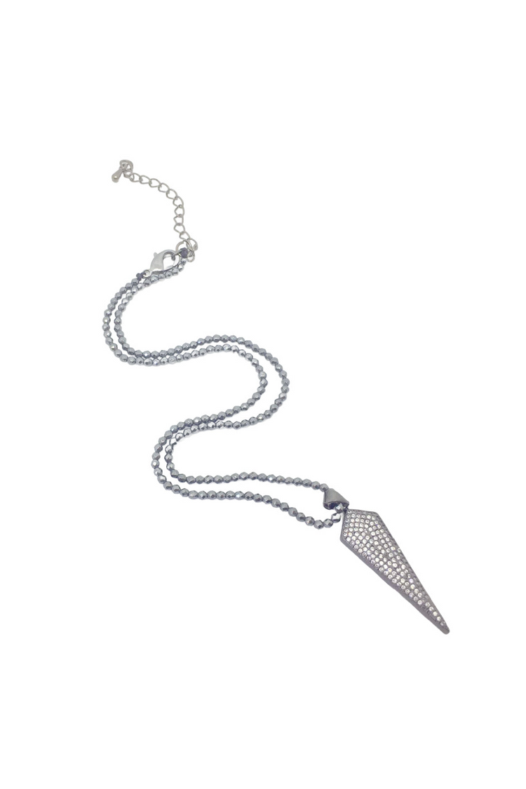 a necklace with a pointed object