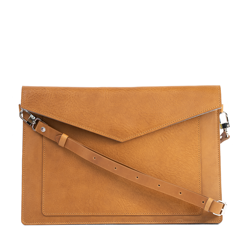 a brown leather bag with a strap