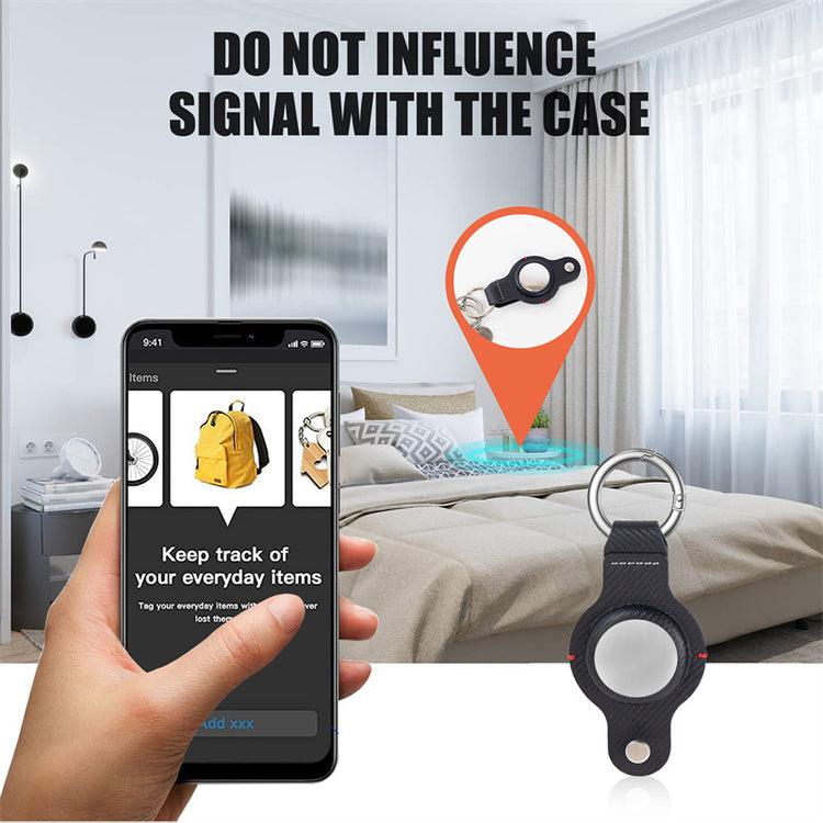 a hand holding a phone with a key chain