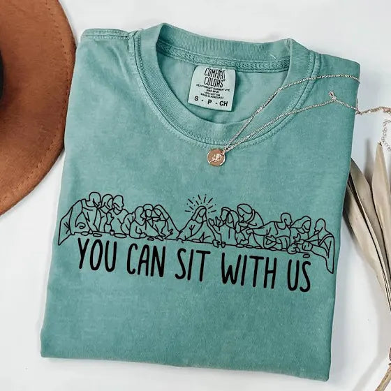 a green shirt with black text on it