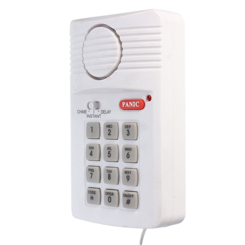 a white alarm device with a button