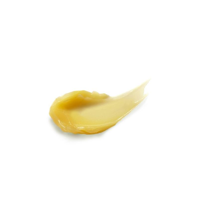 a yellow liquid on a white background