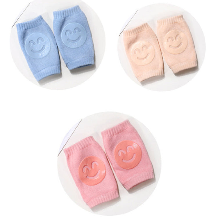a pair of baby socks with smiley faces on them