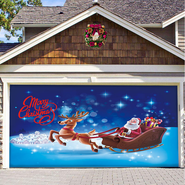 a garage door with a painting of santa claus and reindeer